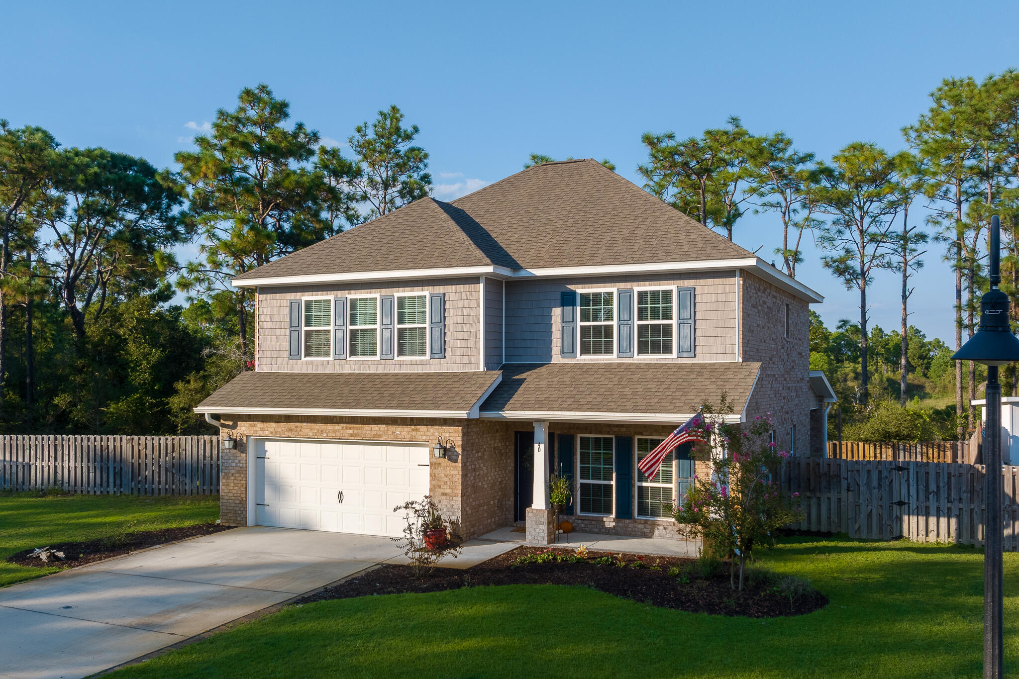 40 Constance Court Santa Rosa Beach, FL 32459 - Photo 1 of 44 a front view of a house with a garden and plants