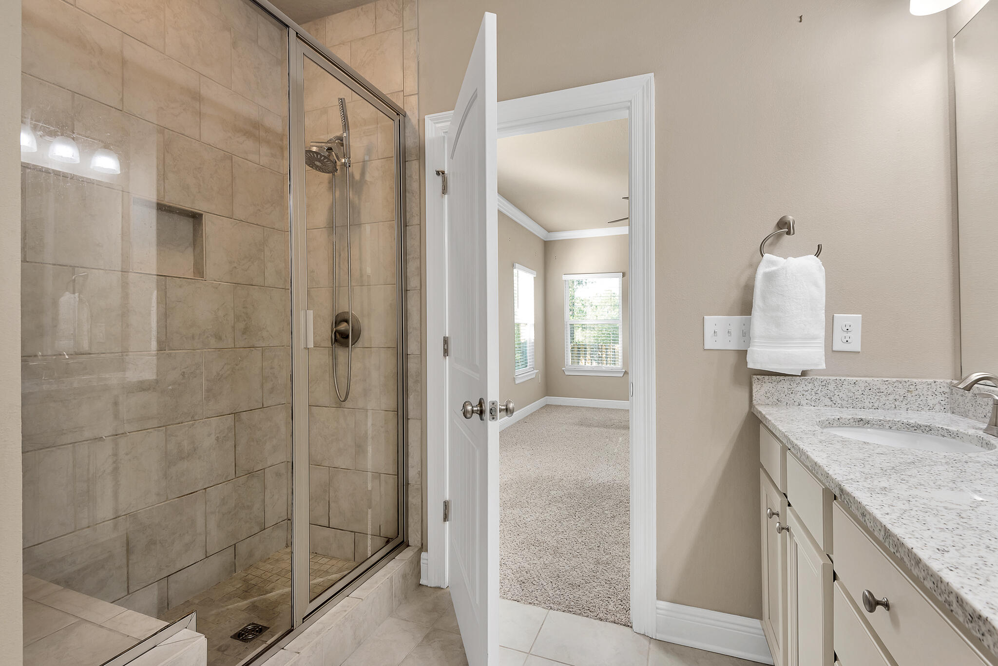 40 Constance Court Santa Rosa Beach, FL 32459 - Photo 21 of 44 a bathroom with a granite countertop shower mirror and a sink