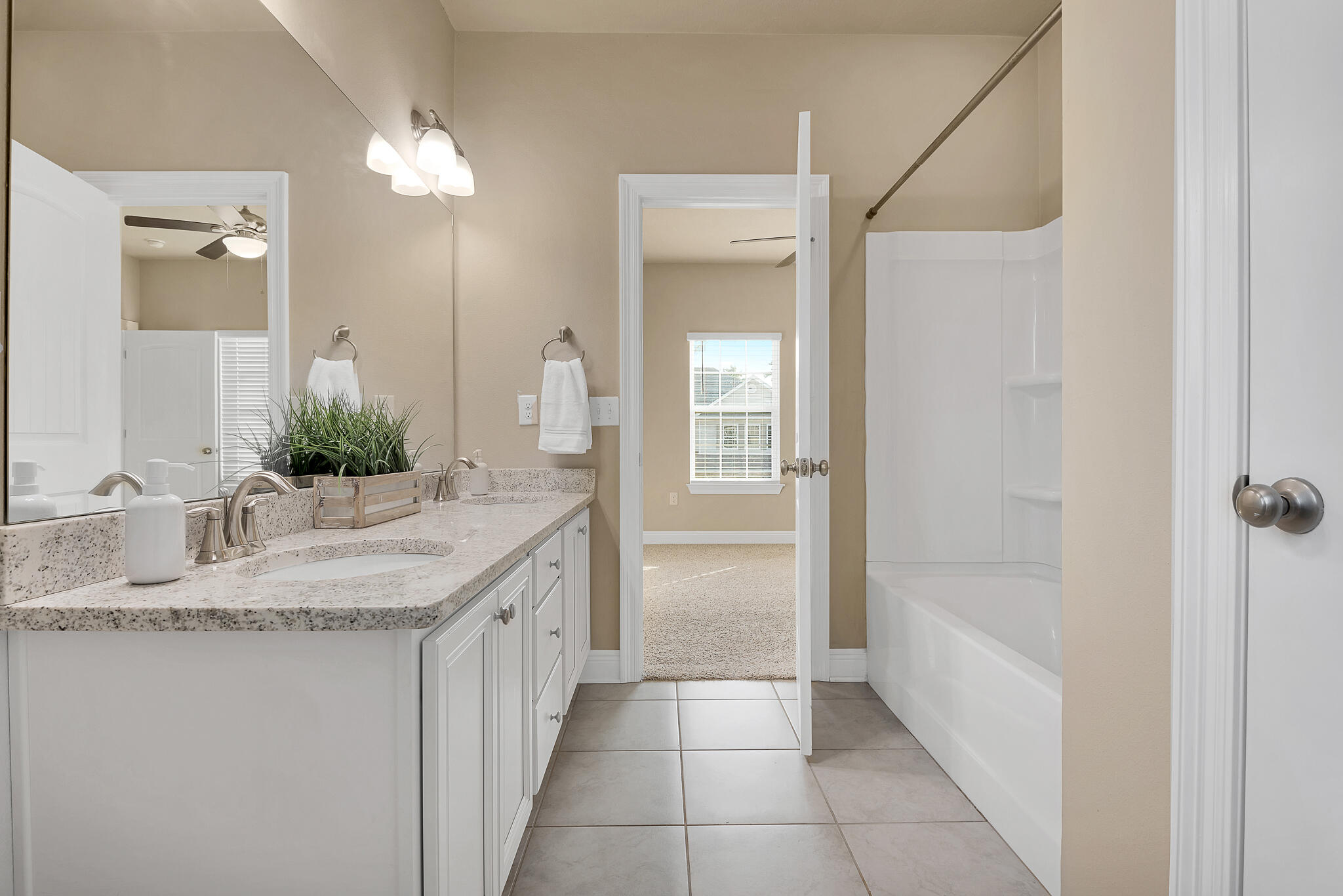 40 Constance Court Santa Rosa Beach, FL 32459 - Photo 26 of 44 a bathroom with a granite countertop sink and a mirror