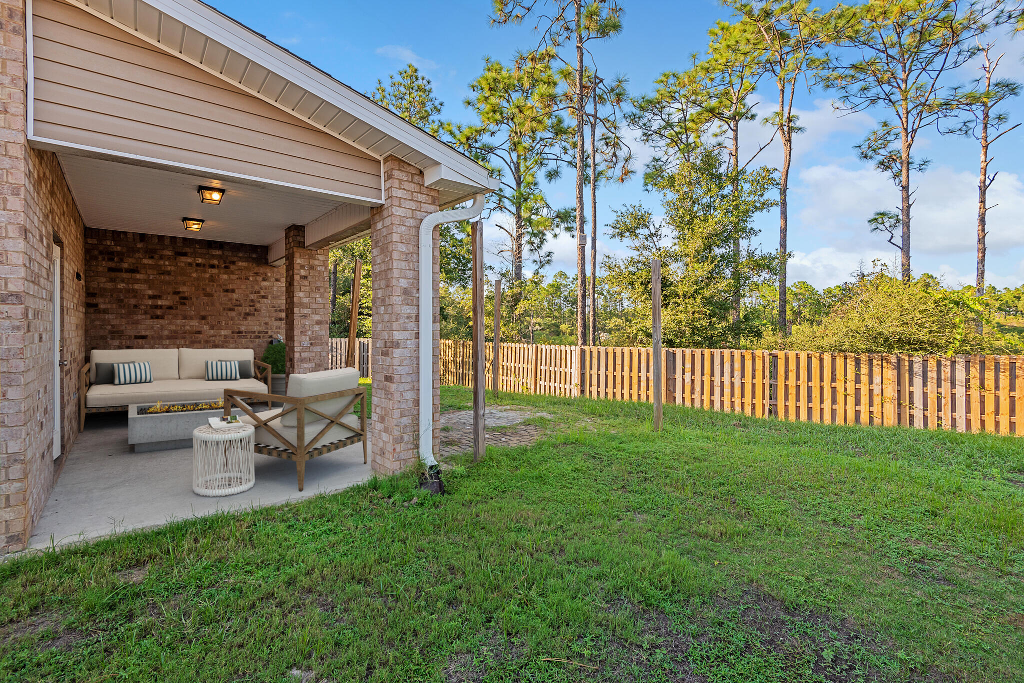 40 Constance Court Santa Rosa Beach, FL 32459 - Photo 39 of 44 a view of a porch with a bench and wooden fence