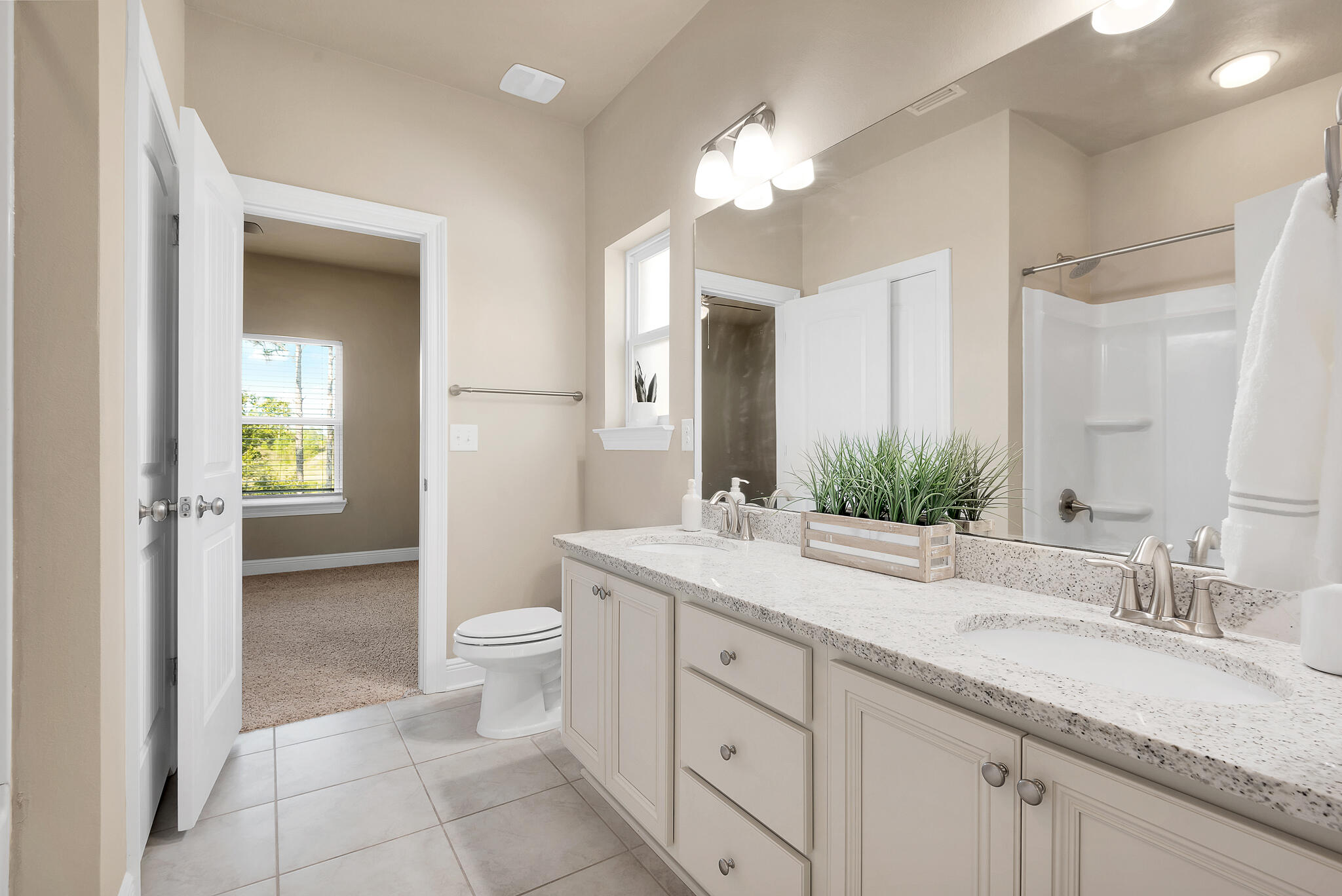 40 Constance Court Santa Rosa Beach, FL 32459 - Photo 5 of 44 a bathroom with a granite countertop sink mirror and a toilet
