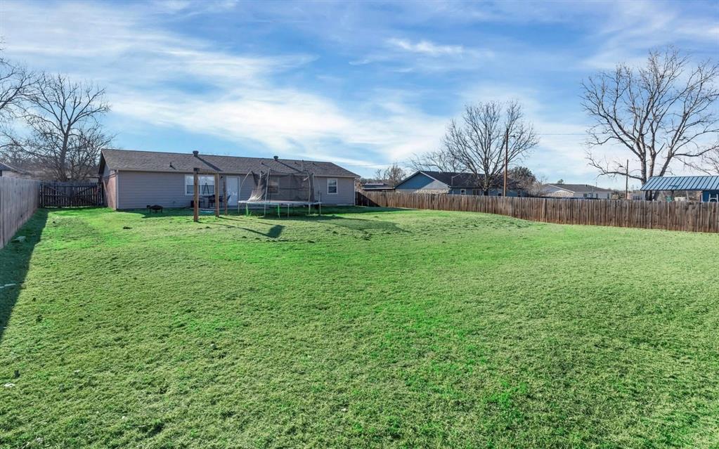 513 Ranch Road Granbury, TX 76049 - Photo 7 of 9 a backyard of a house with lots of green space