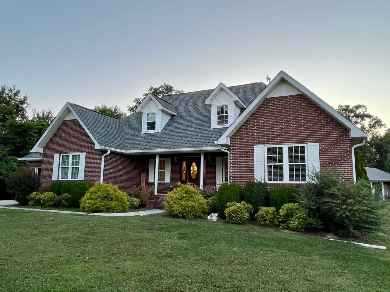 1056 Lois Ridge Road Lynchburg, TN 37352 - Photo 1 of 45 a front view of a house with a yard
