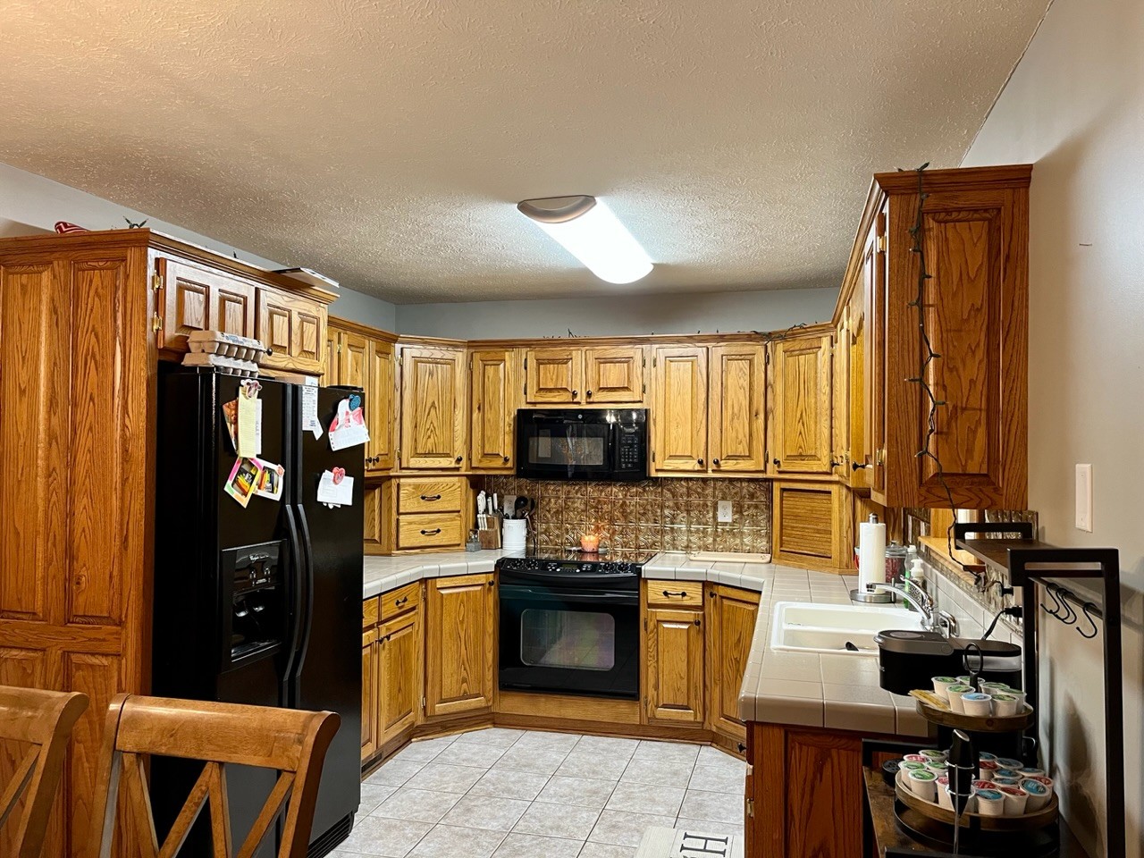 1056 Lois Ridge Road Lynchburg, TN 37352 - Photo 7 of 45 a kitchen with a refrigerator and a stove top oven