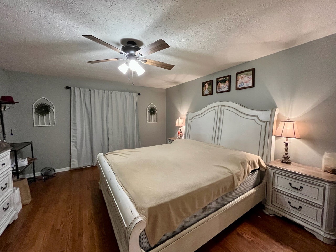 1056 Lois Ridge Road Lynchburg, TN 37352 - Photo 8 of 45 a bedroom with a bed and a chandelier