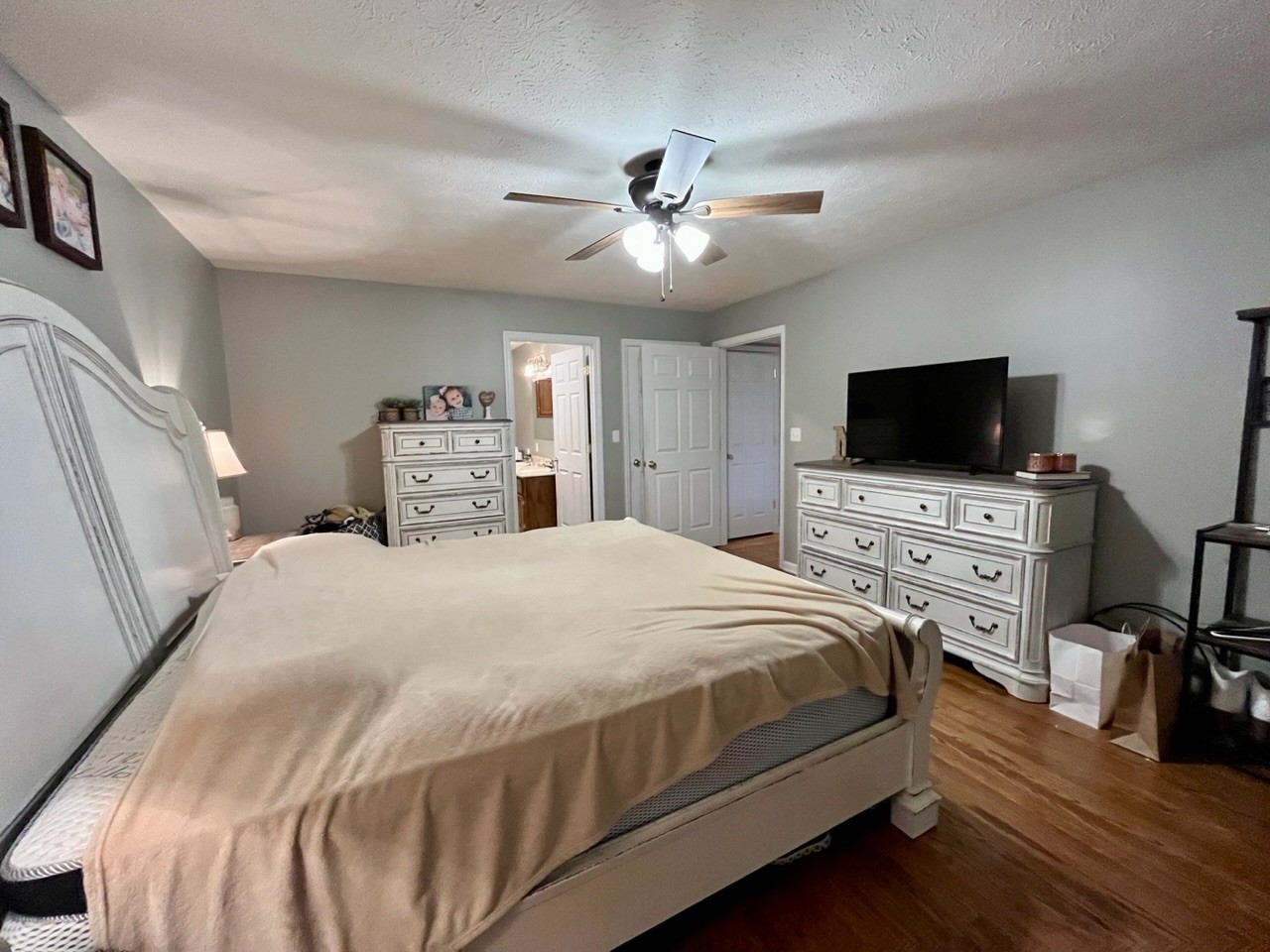 1056 Lois Ridge Road Lynchburg, TN 37352 - Photo 10 of 45 a bedroom with a bed and a flat screen tv