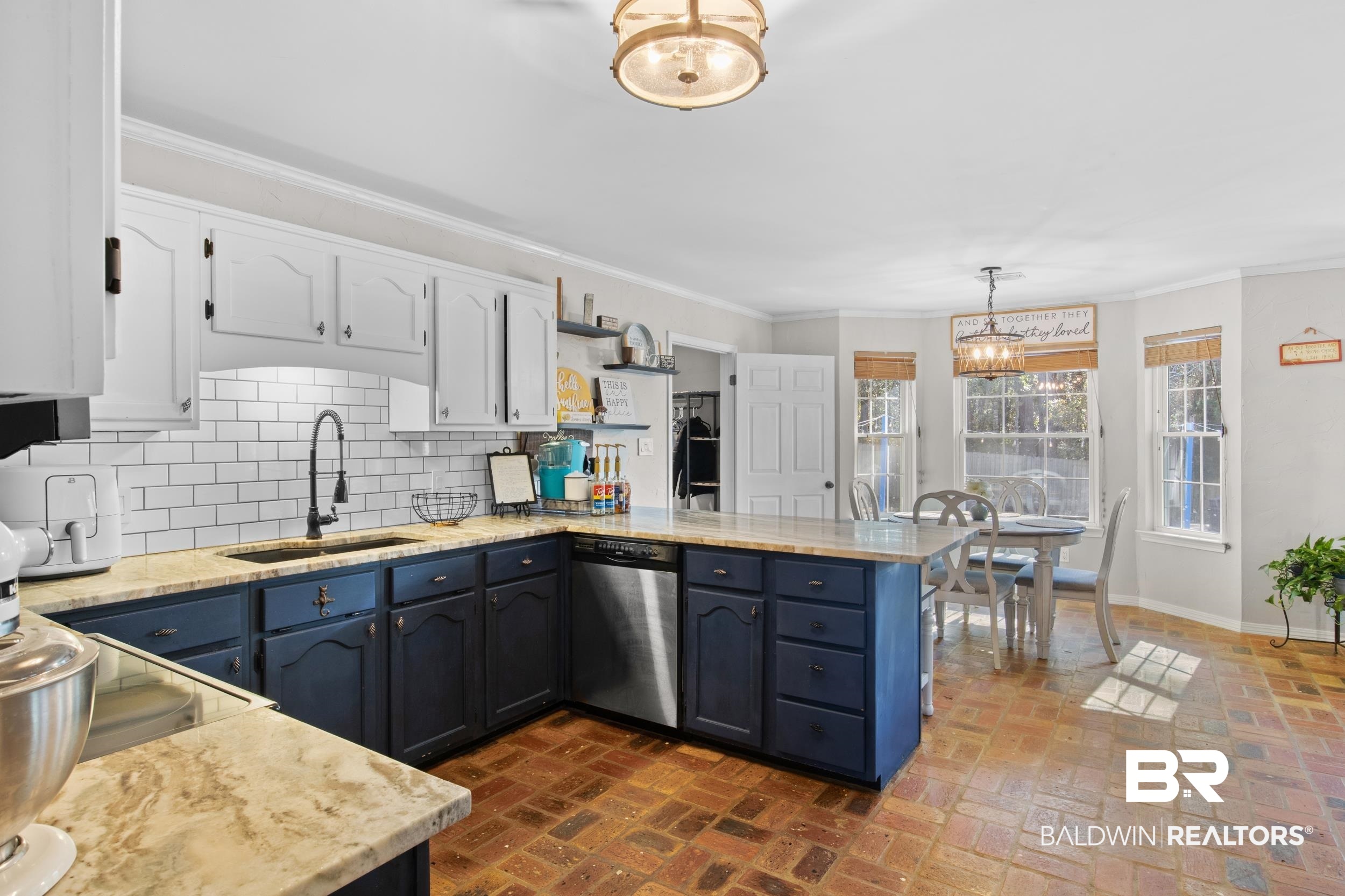 131 Marikesh Drive Daphne, AL 36526 - Photo 14 of 29 Kitchen featuring dishwasher, white cabinetry, sink, hanging light fixtures, and kitchen peninsula