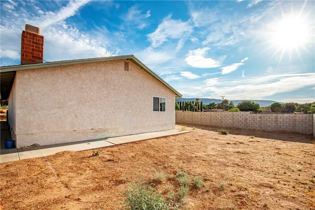 a view of wooden floor and a fence