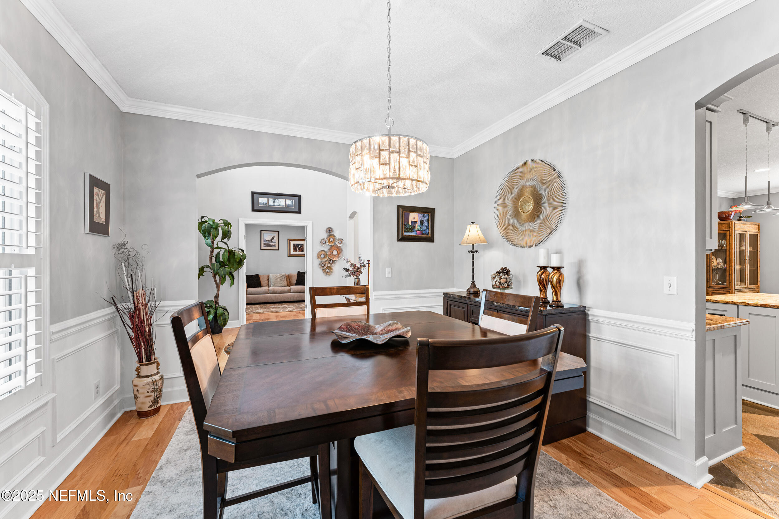 1475 Course View Drive Fleming Island, FL 32003 - Photo 15 of 70 a view of a dining room with furniture window and wooden floor