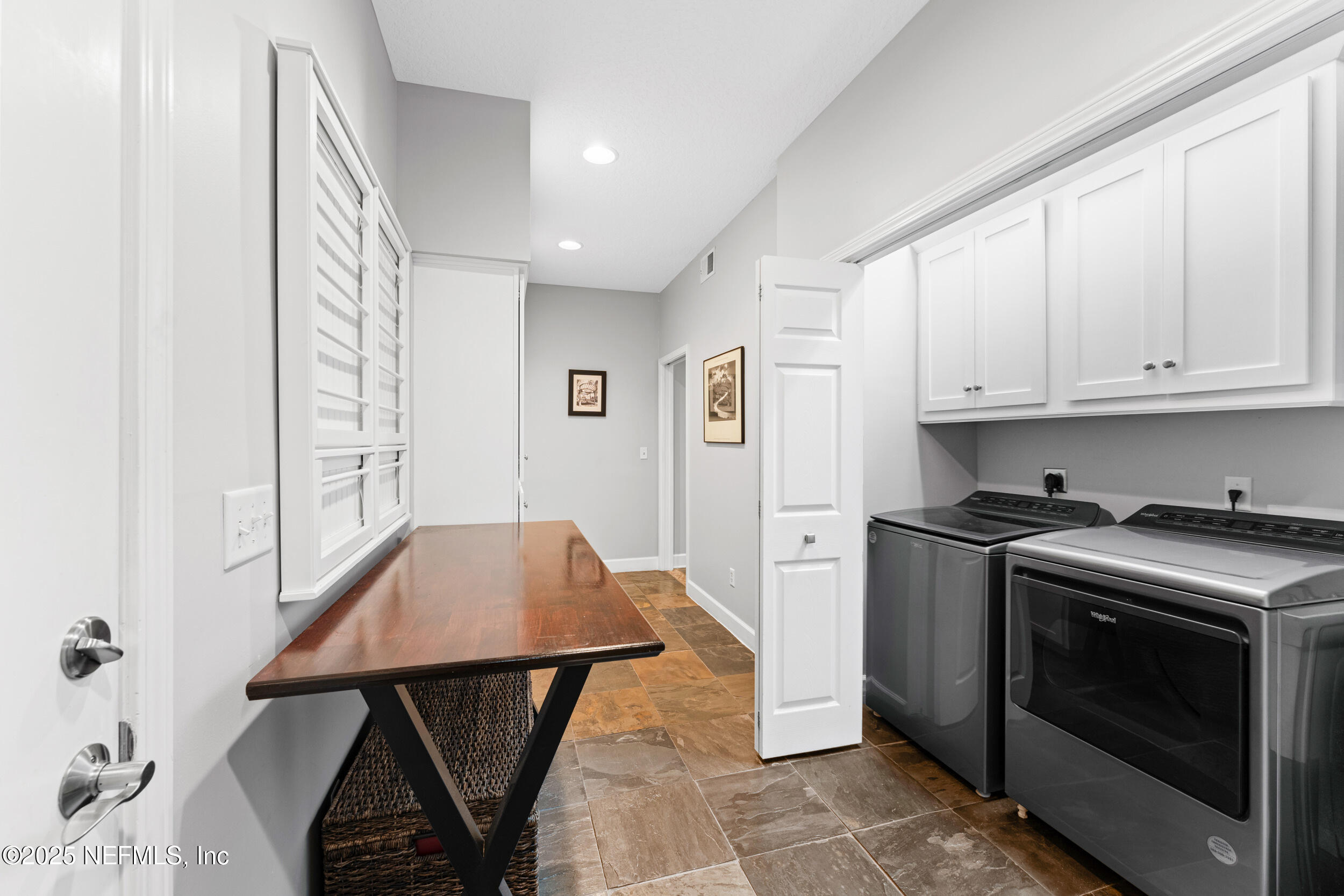 1475 Course View Drive Fleming Island, FL 32003 - Photo 18 of 70 a kitchen with a stove and white cabinets