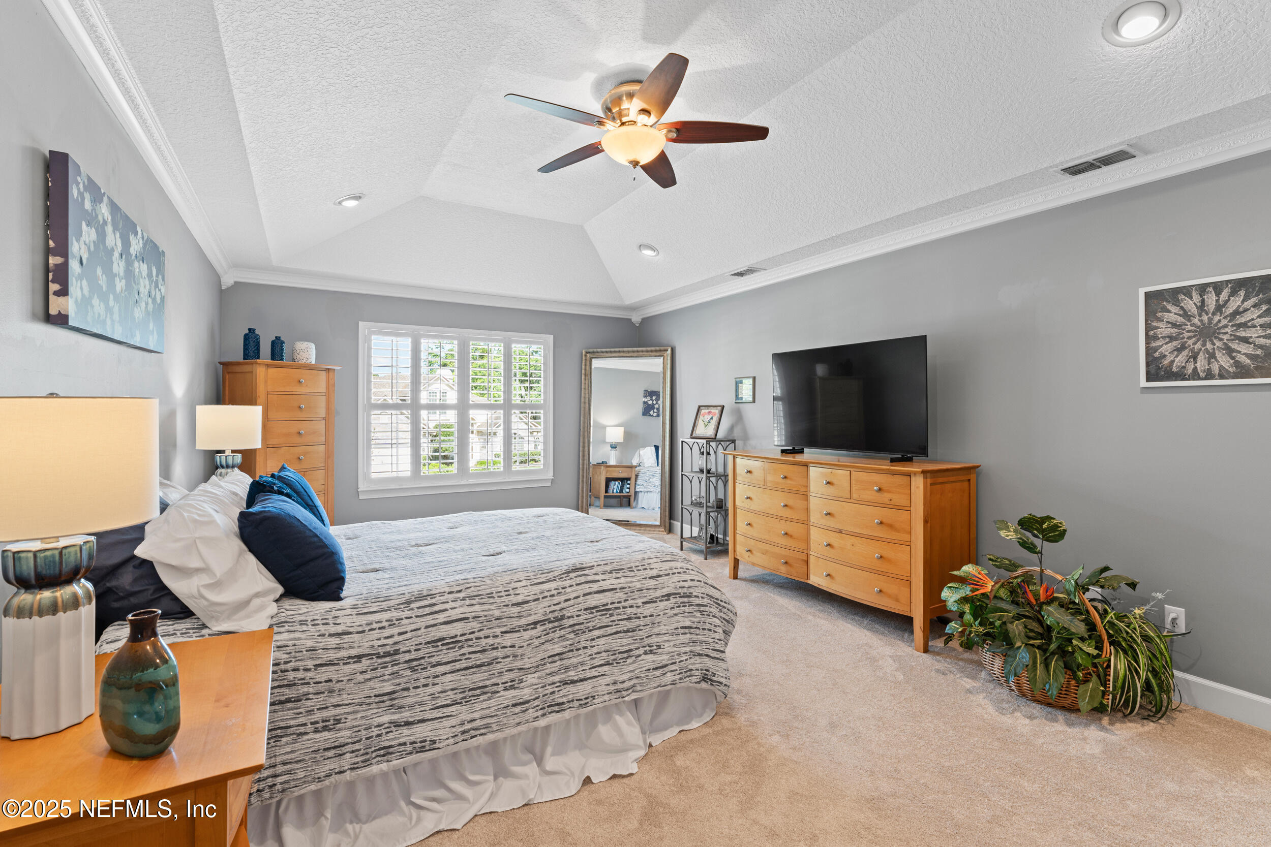 1475 Course View Drive Fleming Island, FL 32003 - Photo 21 of 70 a bedroom with bed tv and window