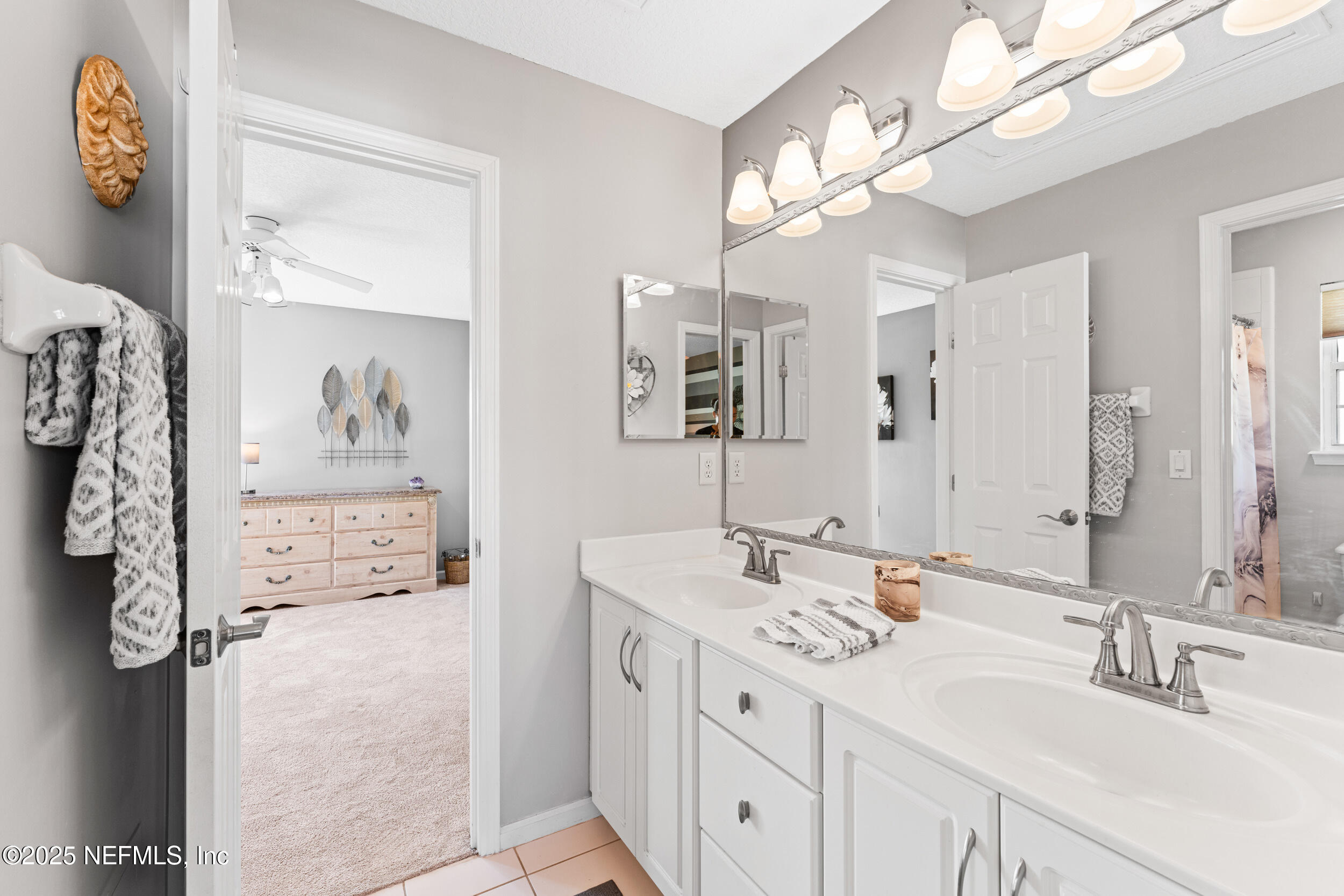 1475 Course View Drive Fleming Island, FL 32003 - Photo 35 of 70 a bathroom with a double vanity sink mirror and