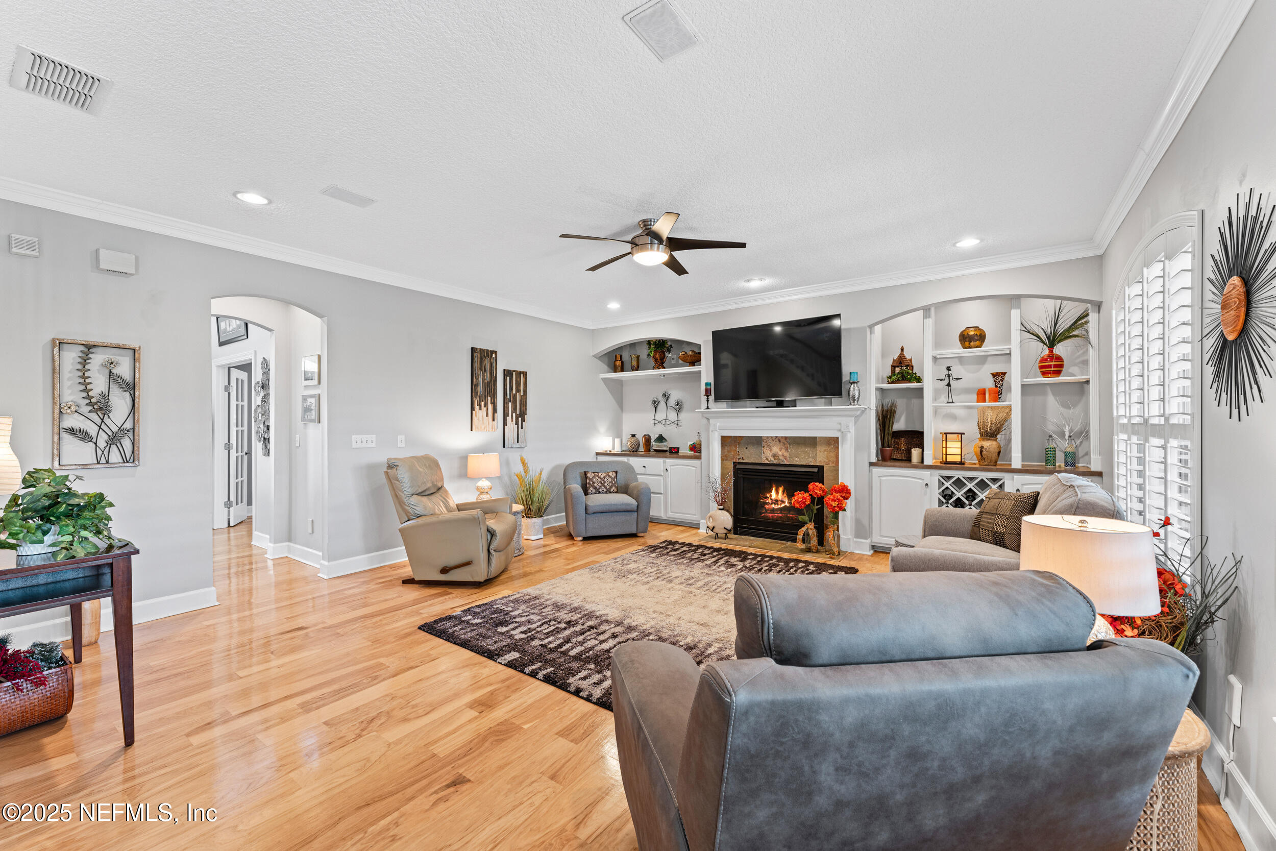 1475 Course View Drive Fleming Island, FL 32003 - Photo 10 of 70 a living room with furniture fireplace and a flat screen tv