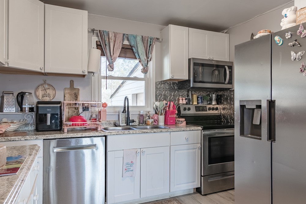 708 Sexton Gin Road Iva, SC 29655 - Photo 12 of 20 This bright kitchen features modern appliances and ample counter space for all your culinary endeavors.