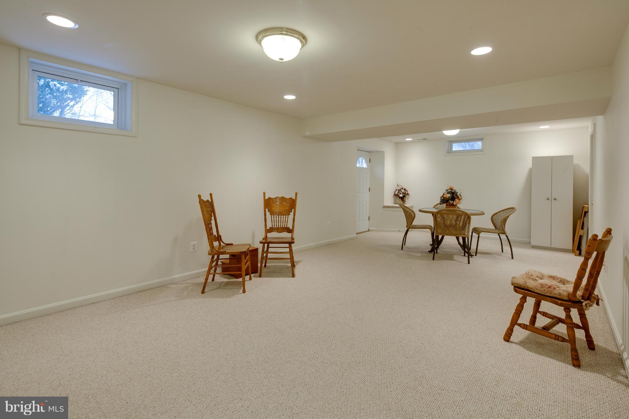 8314 Honey Hill Road Laurel, MD 20723 - Photo 23 of 30 Recreation Room / Welled Exit To Side Yard