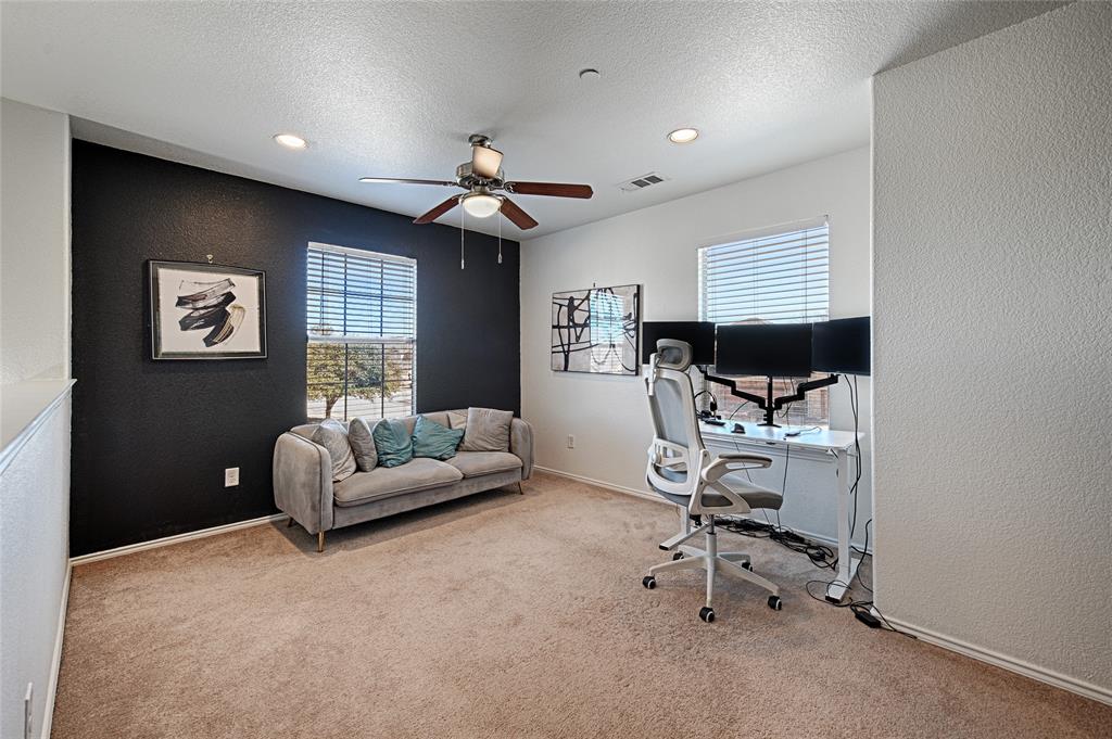 5984 Stone Mountain Road The Colony, TX 75056 - Photo 21 of 25 a living room with furniture and a window