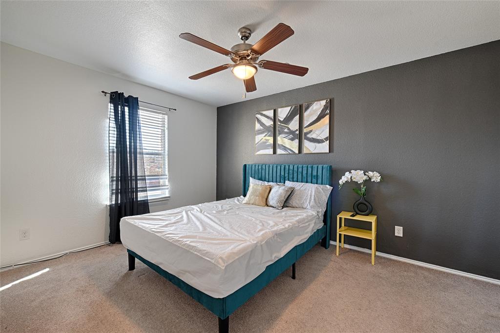 5984 Stone Mountain Road The Colony, TX 75056 - Photo 25 of 25 a bedroom with a bed and a window