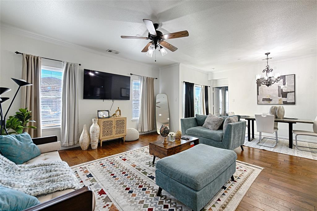 5984 Stone Mountain Road The Colony, TX 75056 - Photo 3 of 25 a living room with furniture and a flat screen tv