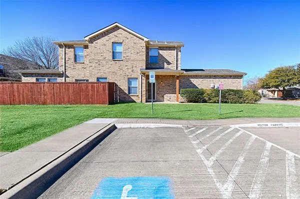 a view of front of house with a yard