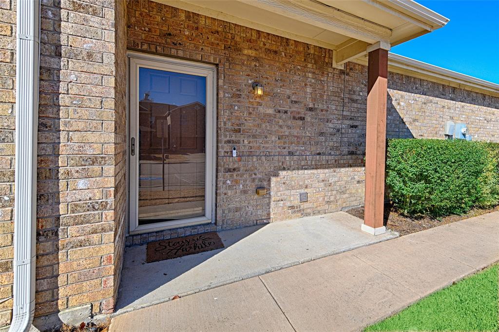 5984 Stone Mountain Road The Colony, TX 75056 - Photo 9 of 25 a view of front door of house