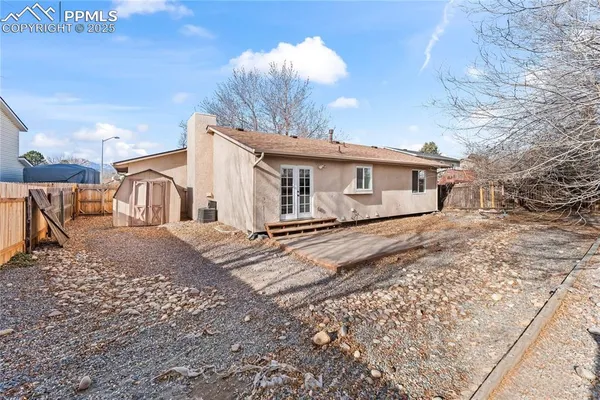 a view of a house with a yard covered in snow