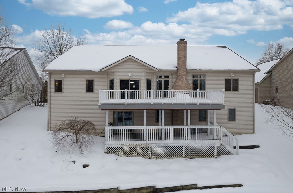 36845 Aberdeen Lane Solon, OH 44139 - Photo 22 of 24 Snow covered back of property featuring a chimney and a balcony