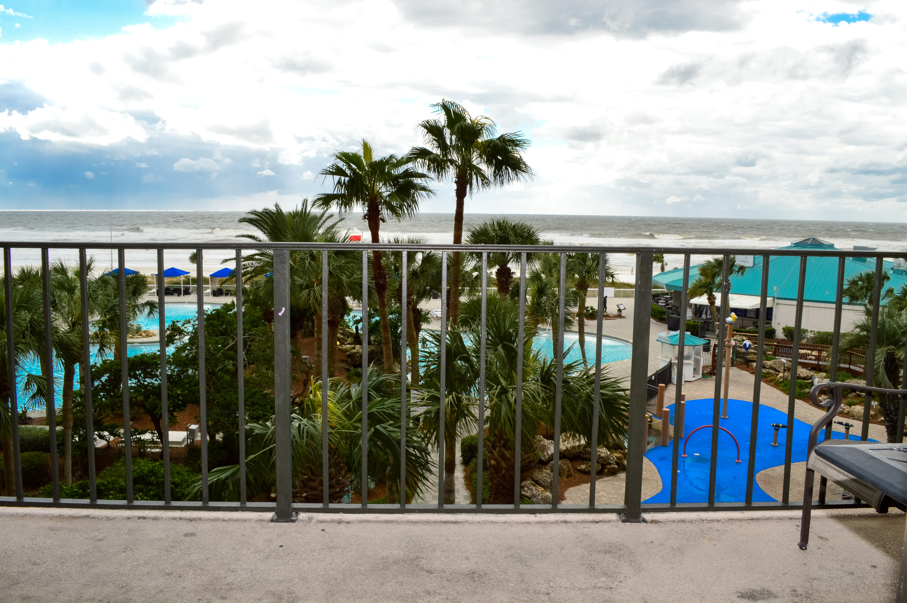 11483 Front Beach Road, Unit 307 Panama City Beach, FL 32407 - Photo 1 of 12 a view of street along with house and trees