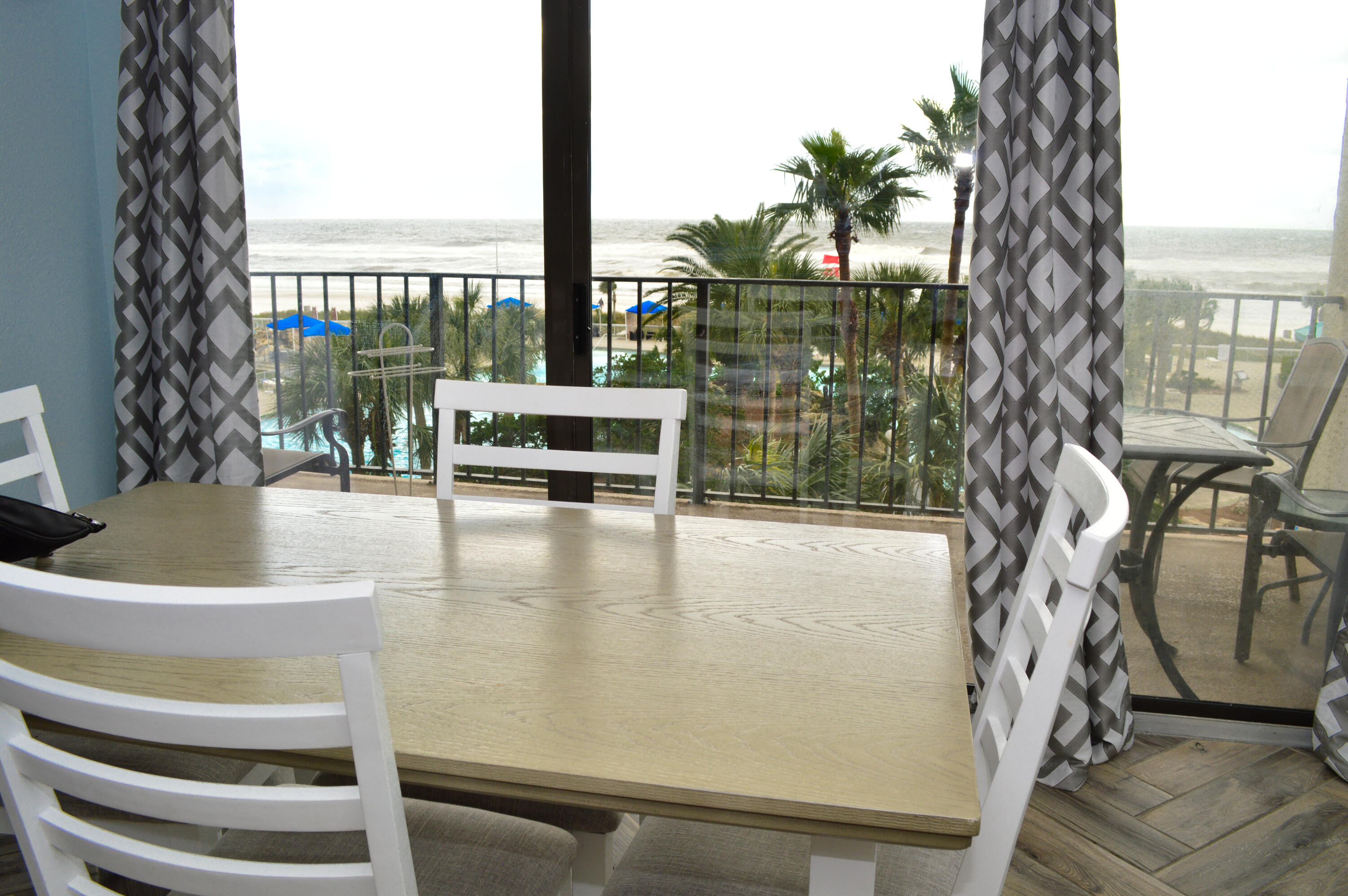 11483 Front Beach Road, Unit 307 Panama City Beach, FL 32407 - Photo 2 of 12 a view of outdoor space with seating area