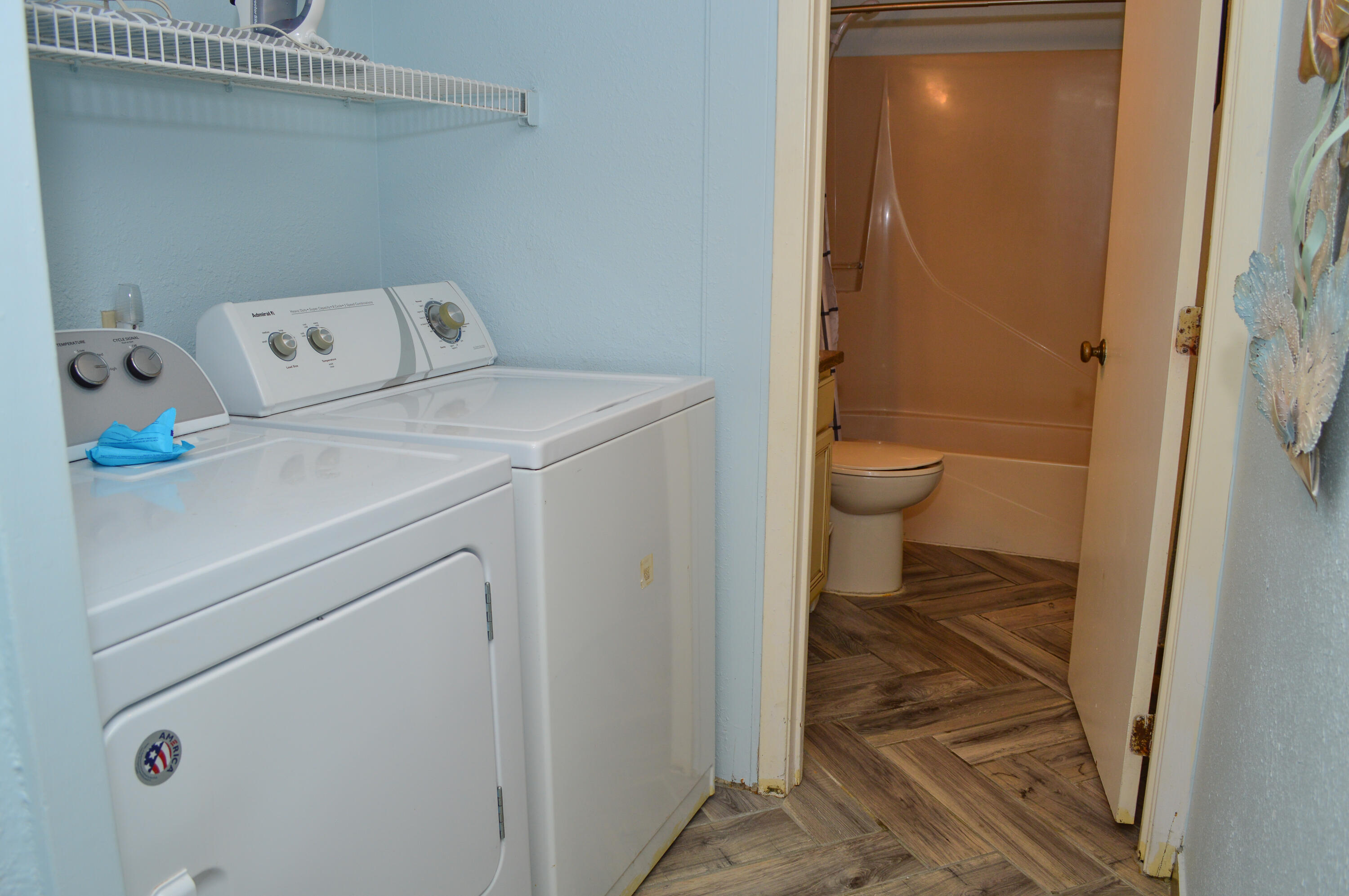 11483 Front Beach Road, Unit 307 Panama City Beach, FL 32407 - Photo 5 of 12 a bathroom with a toilet and a shower