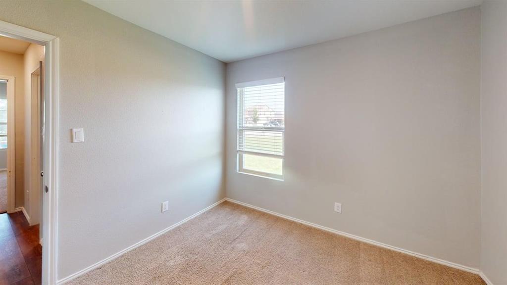 331 Buckeye Avenue Princeton, TX 75407 - Photo 11 of 22 a view of empty room with windows