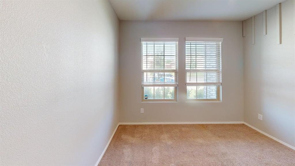331 Buckeye Avenue Princeton, TX 75407 - Photo 13 of 22 an empty room with a window