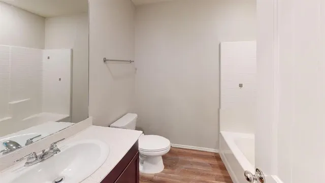a bathroom with a toilet and a bathtub