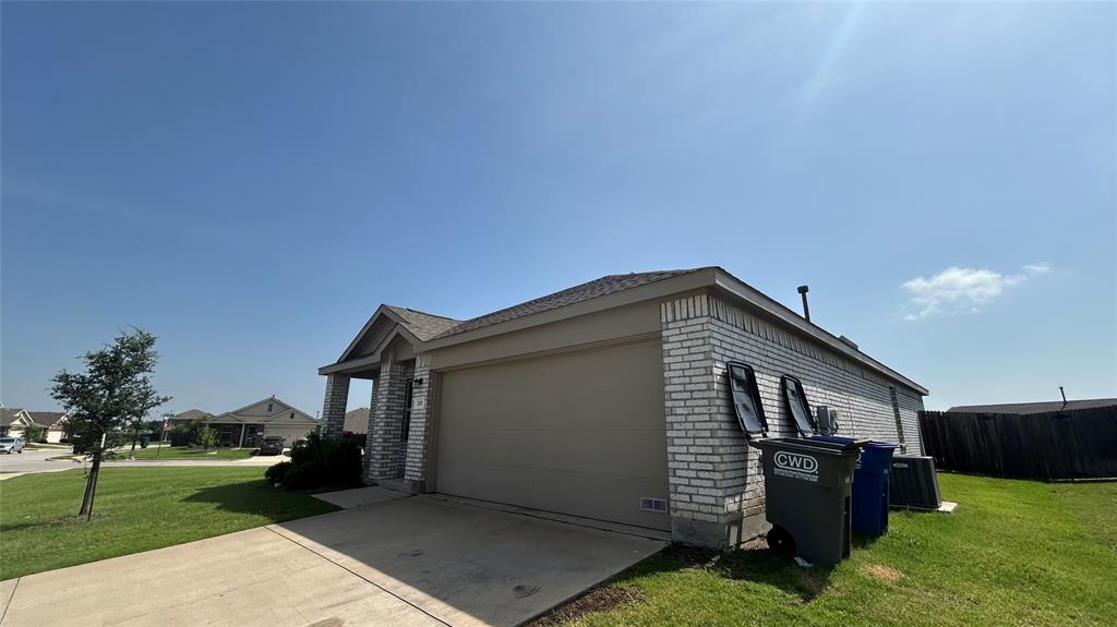 331 Buckeye Avenue Princeton, TX 75407 - Photo 22 of 22 a front view of a house with garden