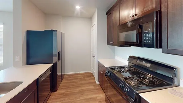 a kitchen with a stove and a microwave