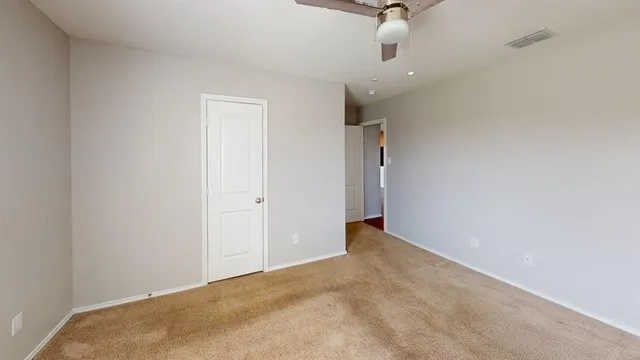 a view of empty room with windows