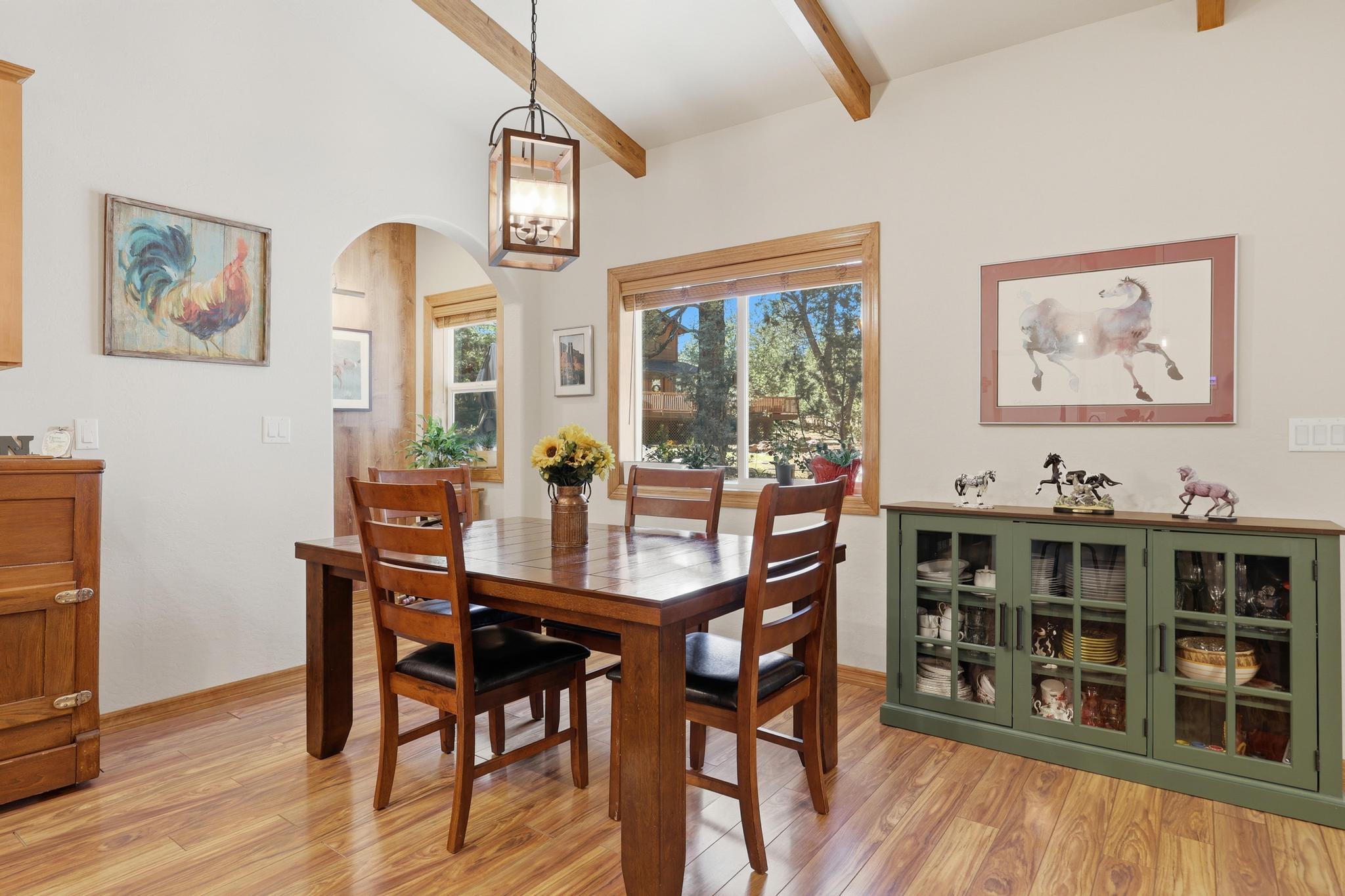 5501 Solitude Trail Loop Pine, AZ 85544 - Photo 27 of 27 a view of a dining room with furniture window and wooden floor