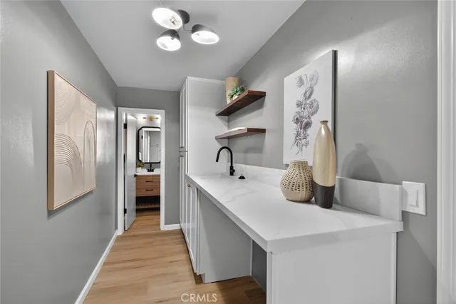 a kitchen with stainless steel appliances a sink stove and refrigerator