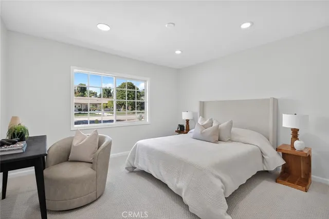 a bedroom with two beds and a couch