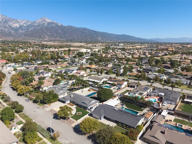 an aerial view of residential house and green space