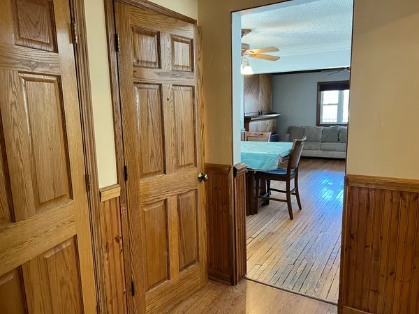 a view of a livingroom with furniture and wooden floor