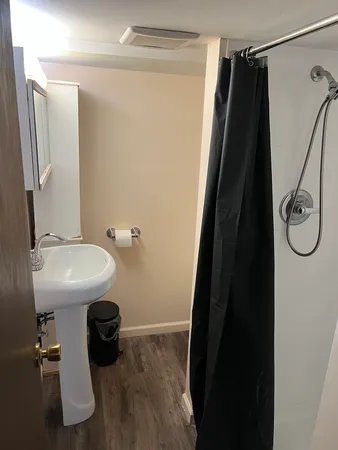 a view of an empty room with a fireplace