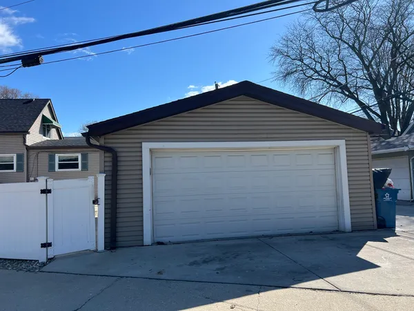 a front view of a house with garage