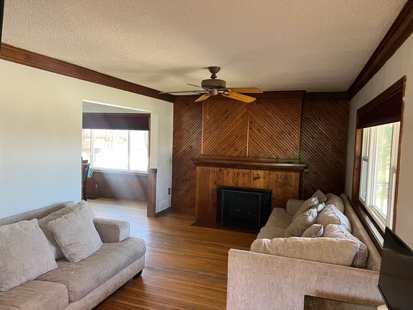 a living room with furniture and a fireplace