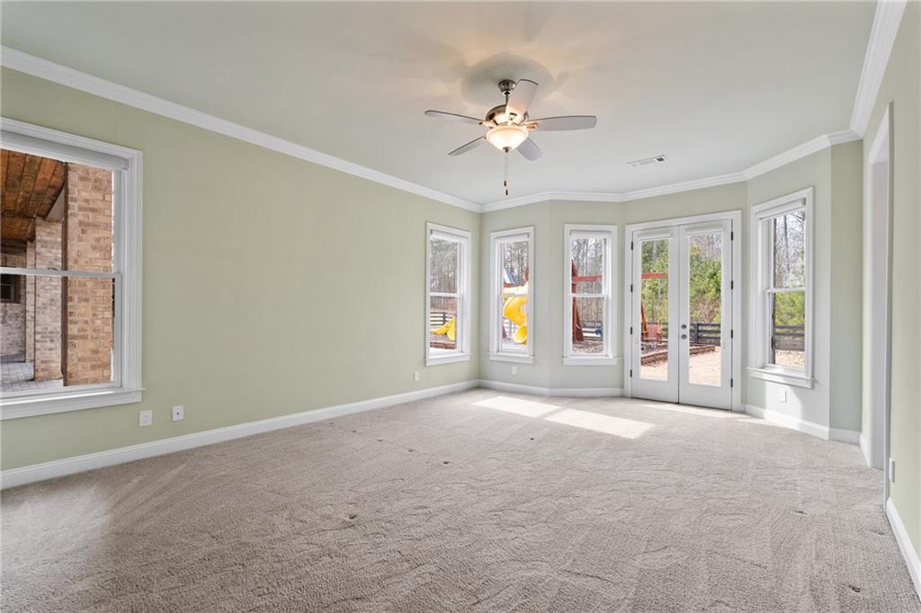 14560 Wood Road Milton, GA 30004 - Photo 57 of 74 a view of an empty room with a window