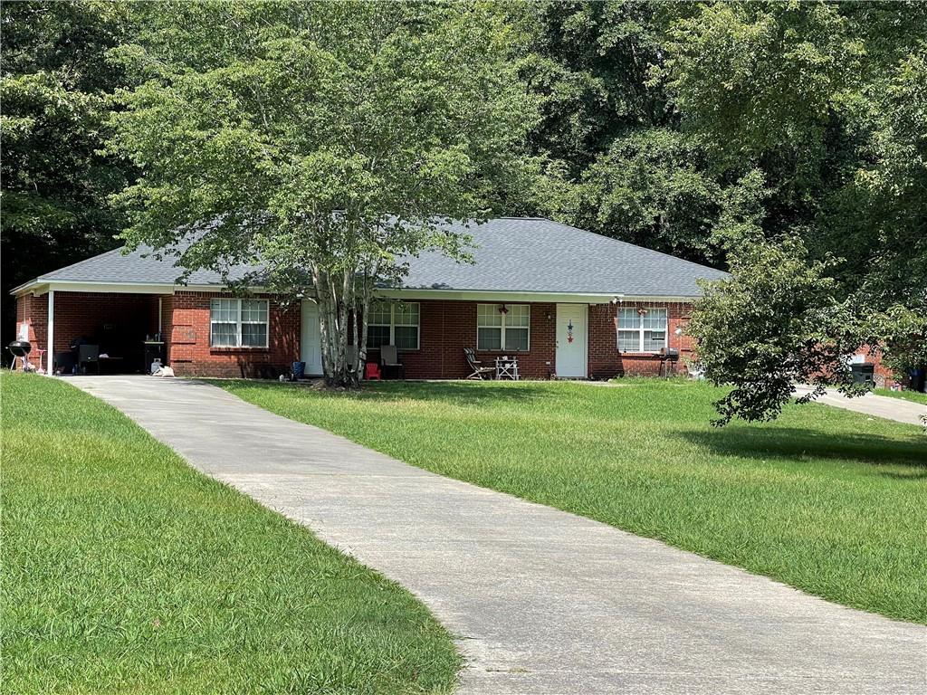 25 West Drive Rome, GA 30165 - Photo 1 of 1 a front view of a house with a yard and green space