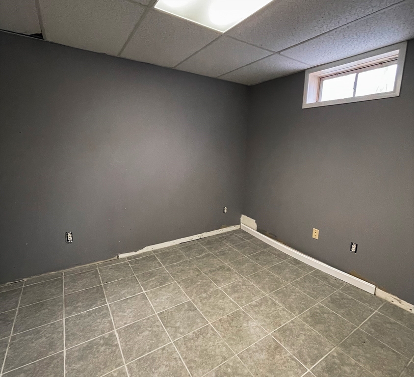 836 Bemis Road Warren, MA 01585 - Photo 19 of 24 a view of an empty room with windows