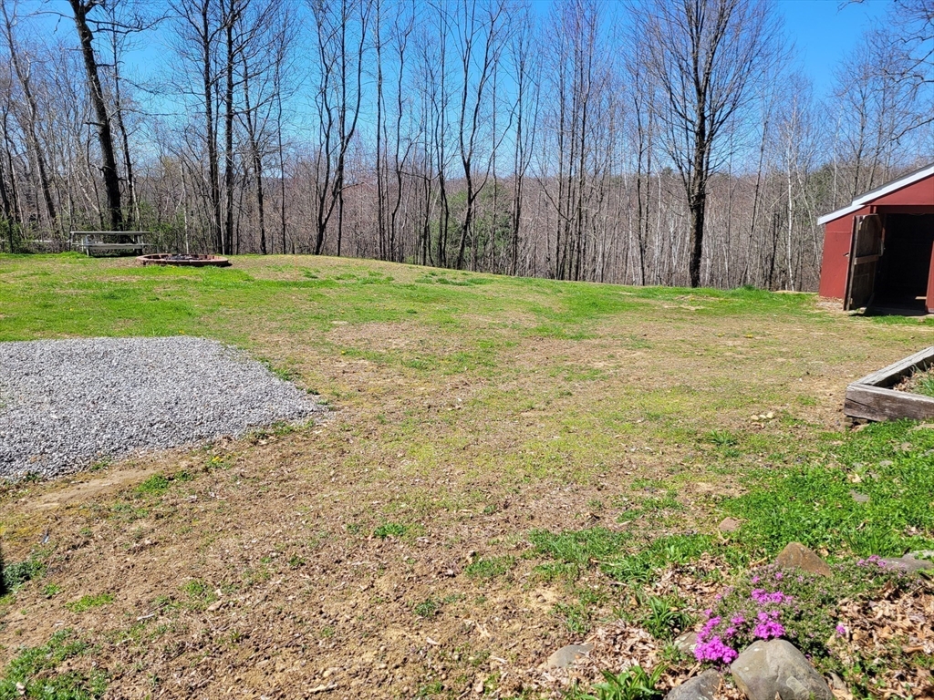 836 Bemis Road Warren, MA 01585 - Photo 22 of 24 a view of a backyard with large trees