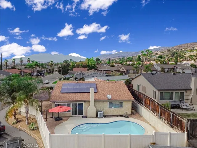 a terrace with outdoor seating and city view