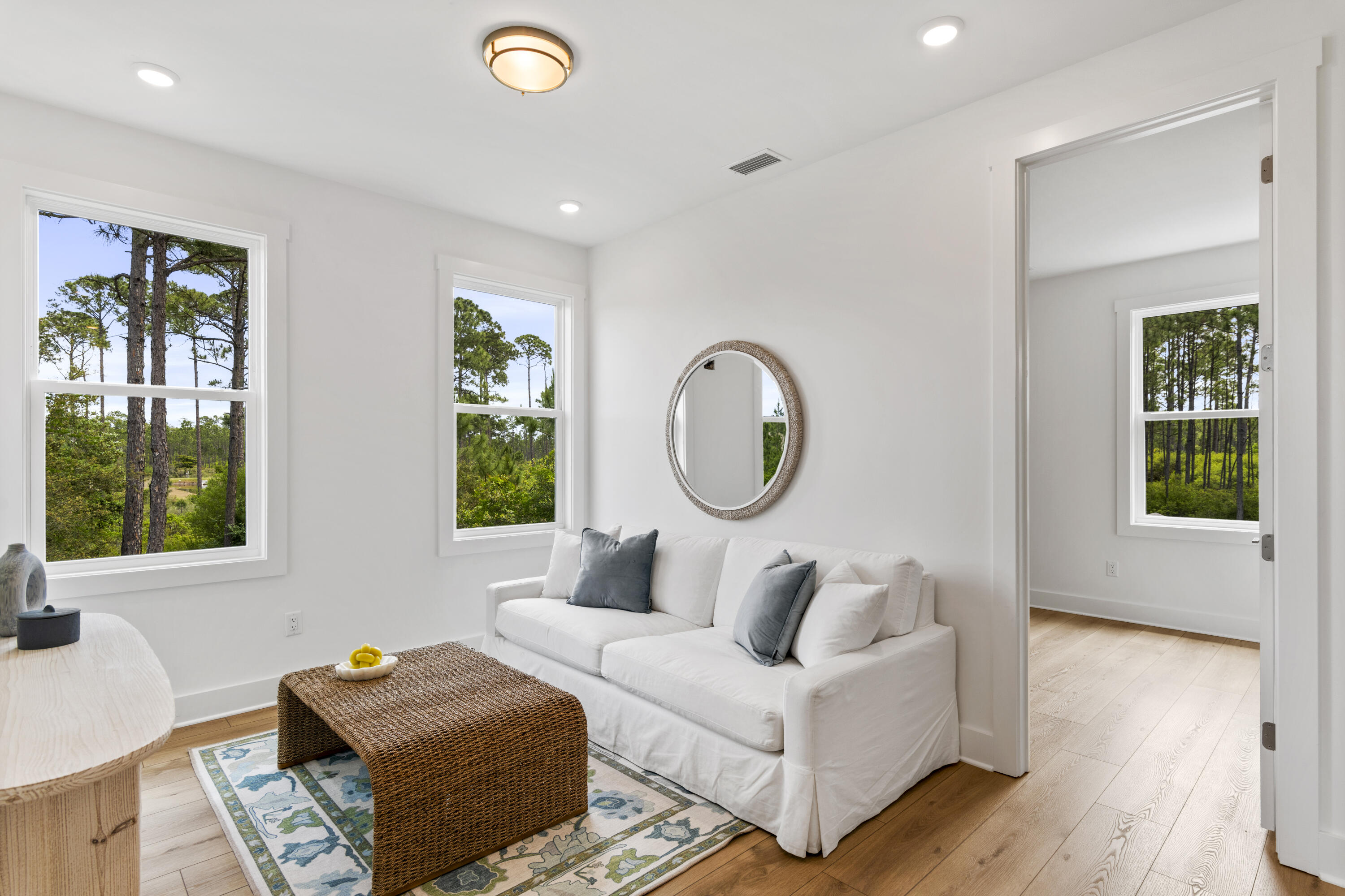 141 Brizo Lane, Unit LOT 4 Santa Rosa Beach, FL 32459 - Photo 11 of 32 a living room with furniture and a window