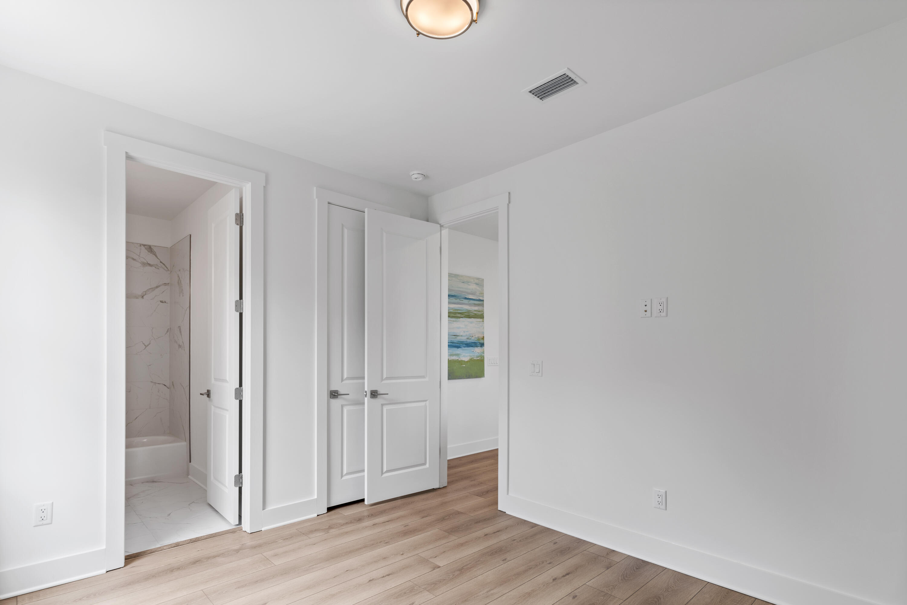 141 Brizo Lane, Unit LOT 4 Santa Rosa Beach, FL 32459 - Photo 14 of 32 an empty room with wooden floor and window